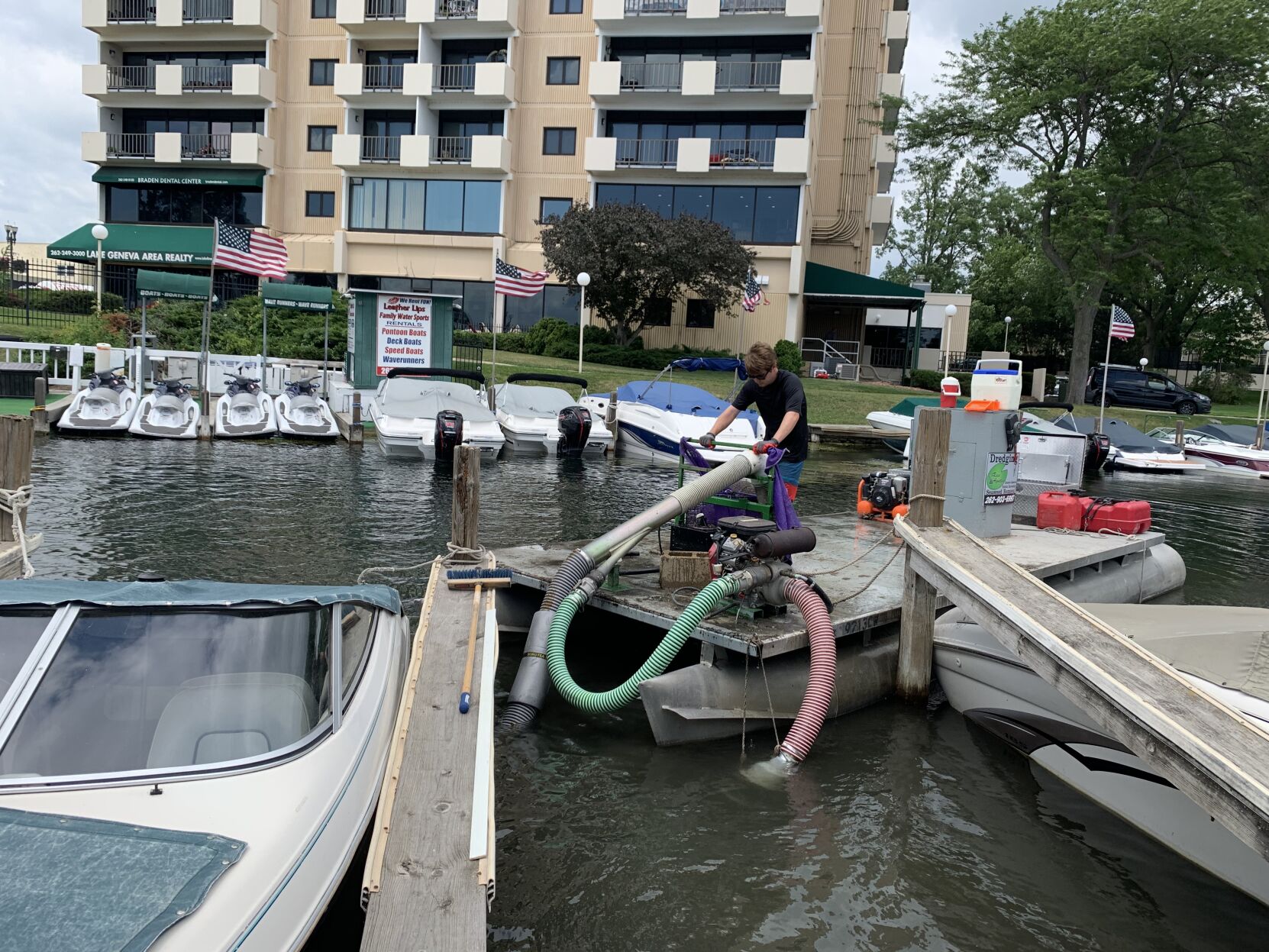 Debris being removed from Lake Geneva's boat pier lagoon